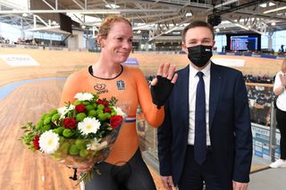 Kirsten Wild of the Netherlands won bronze in Points race in her final UCI event and presented with flowers by UCI President David Lappartien