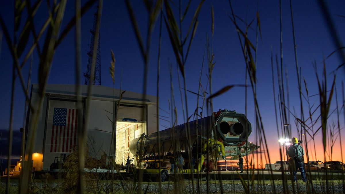 A Northrop Grumman Antares rocket is seen as it is rolled out of the Horizontal Integration Facility to launch Pad-0A, Tuesday, Oct. 29, 2019, at NASA's Wallops Flight Facility in Virginia.
