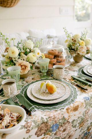 fall table decor ideas with fresh green color palette and splatterware plates, fresh flowers, and pear place holders