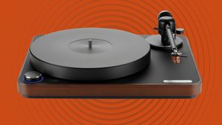 The Clearaudio Concept Signature against an orange background