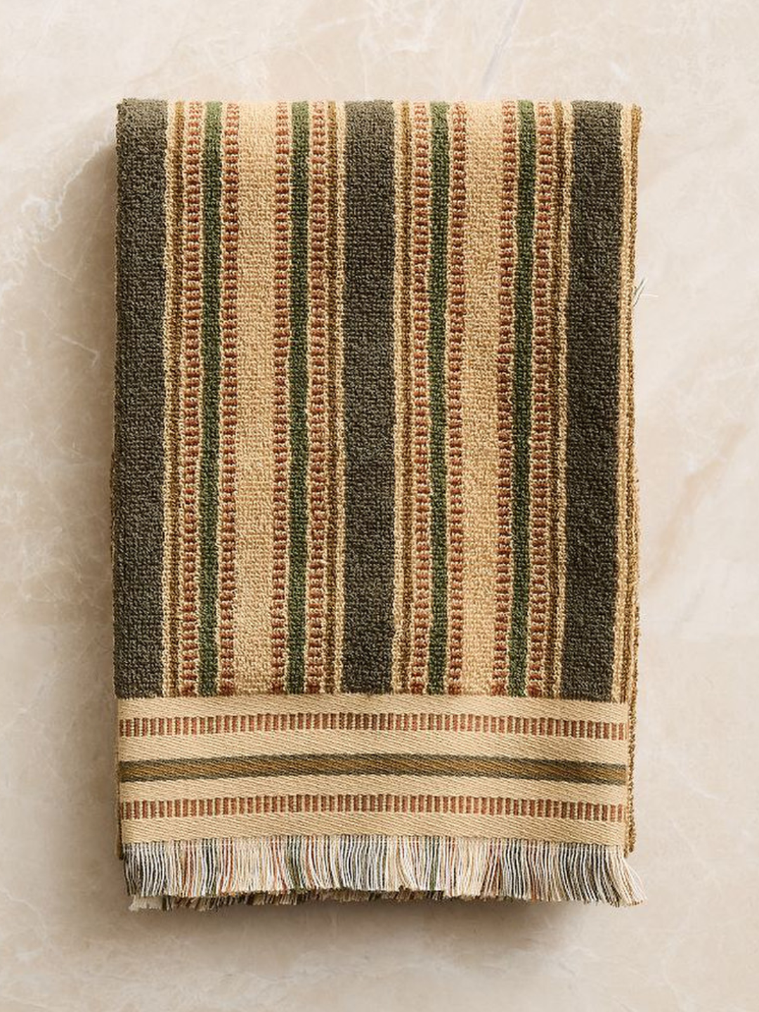 A stripe and blocked patterned towel from West Elm