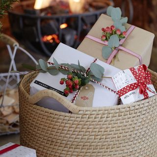 gift boxes in wooden basket and bowl