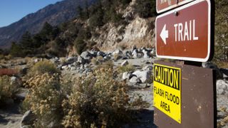 Flood warning sign on a hiking trail