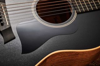 A thin finish allows the timber's grain to show through. Note the AD17 Blacktop’s black pickguard, simple soundhole rosette and beautifully grained ovangkol back and sides.