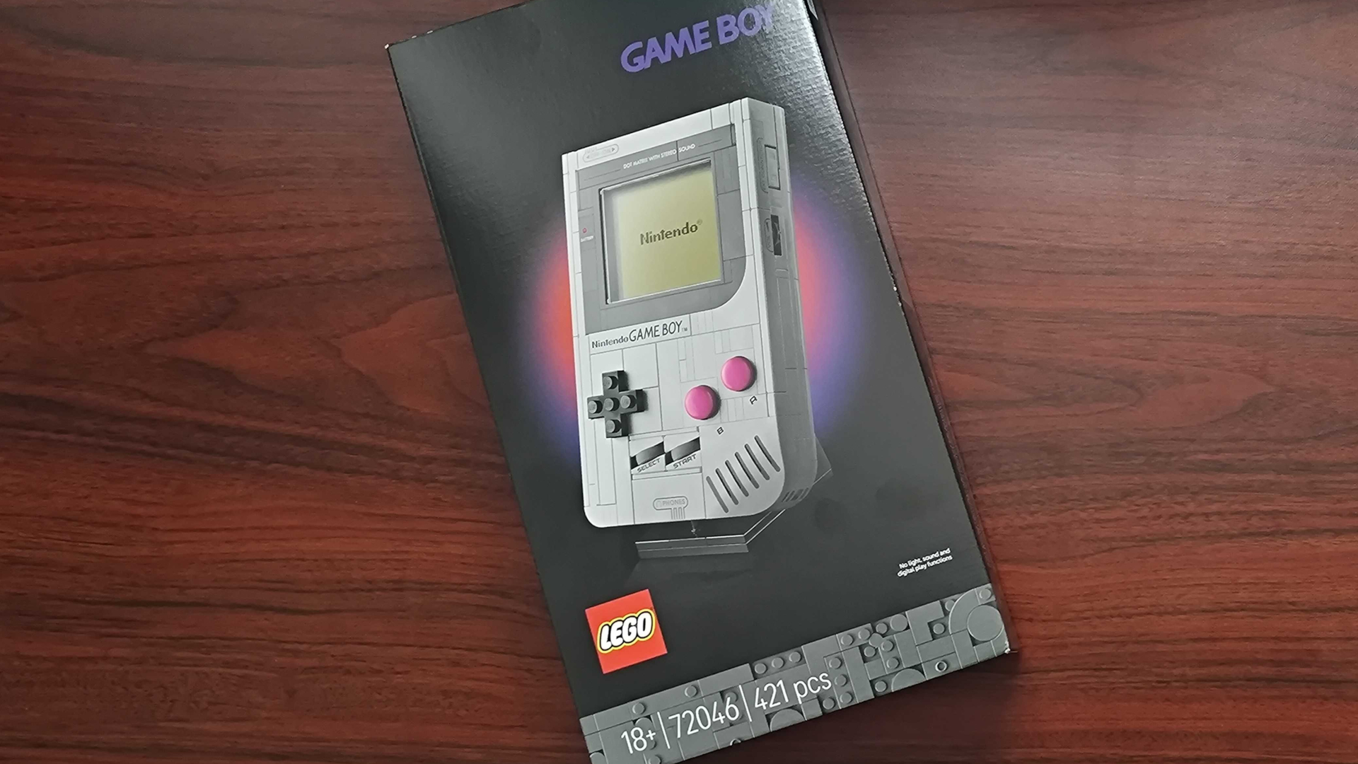 Lego Game Boy box laid out on a wooden table