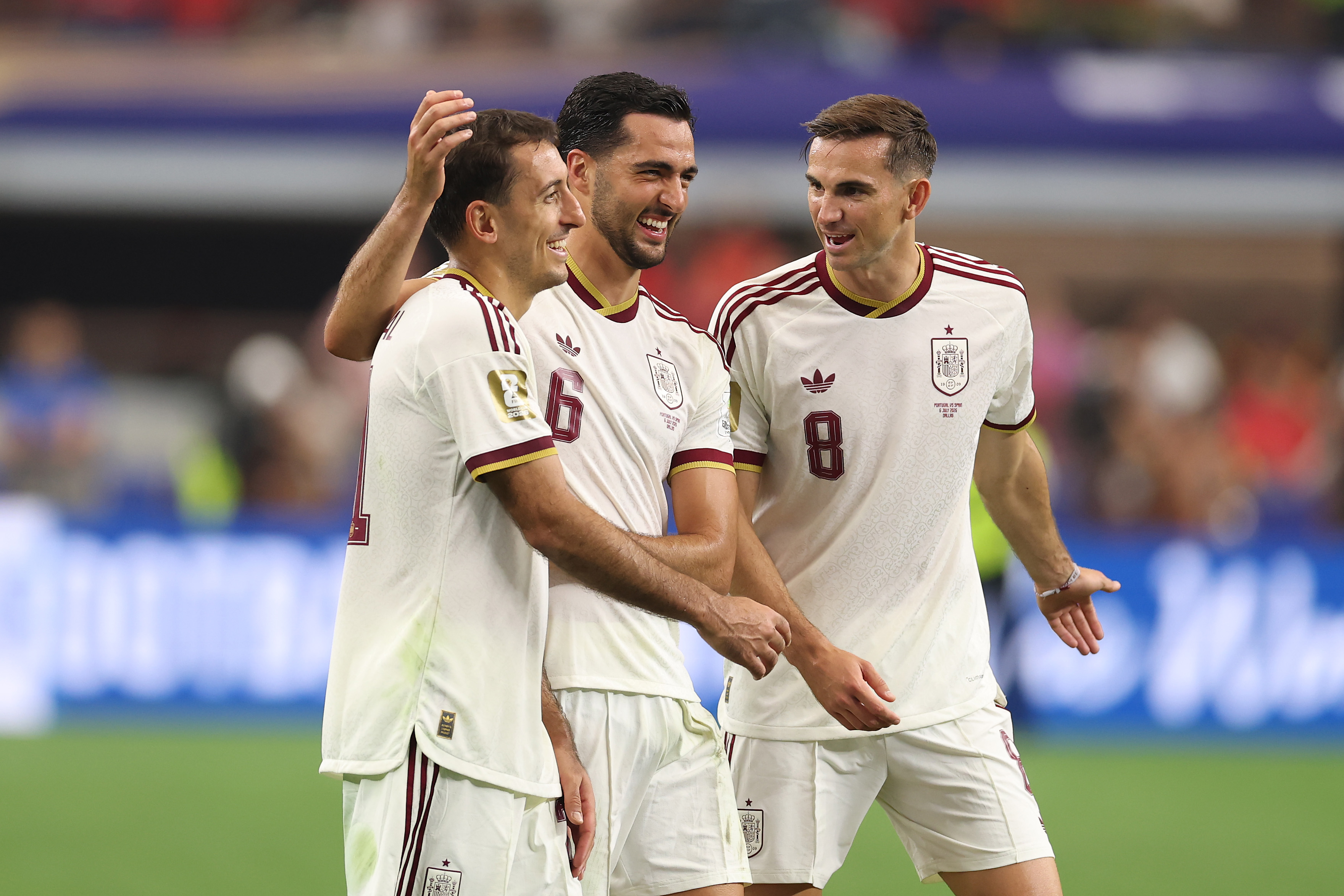 Spain trio of players hugging.