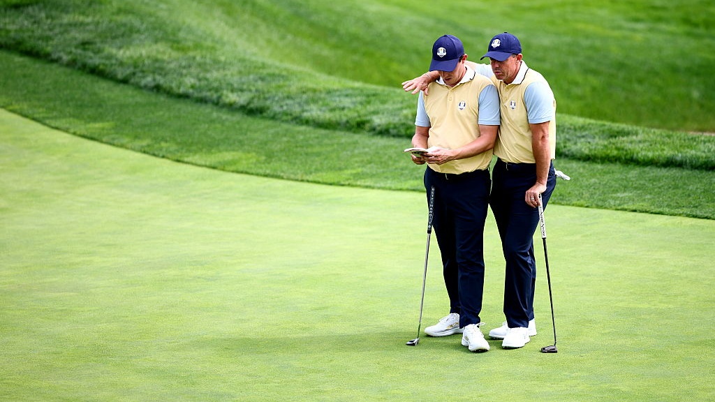 Matt Fitzpatrick, left, and Rory McIlroy of Europe during a practice round before the 2025 Ryder Cup at Black Course at Bethpage State Park Golf Course in Farmingdale, New York, USA. 