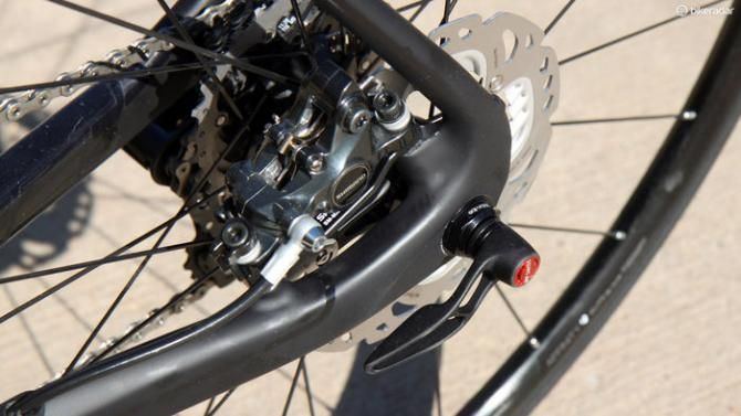 The rear disc caliper is neatly tucked away in between the stays