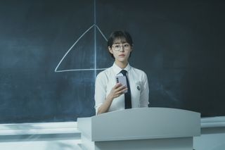 Pyramid Game promo image featuring a student standing in front of a pyramid drawing