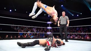 Kota Ibushi flies over Sean Maluta. Image: WWE