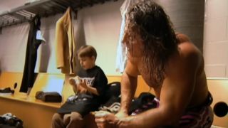 Bret Hart sitting in a locker room in Hitman Hart: Wrestling with Shadows