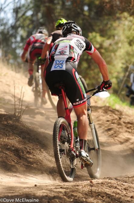 Rides head up on of the many steep, dusty climbs