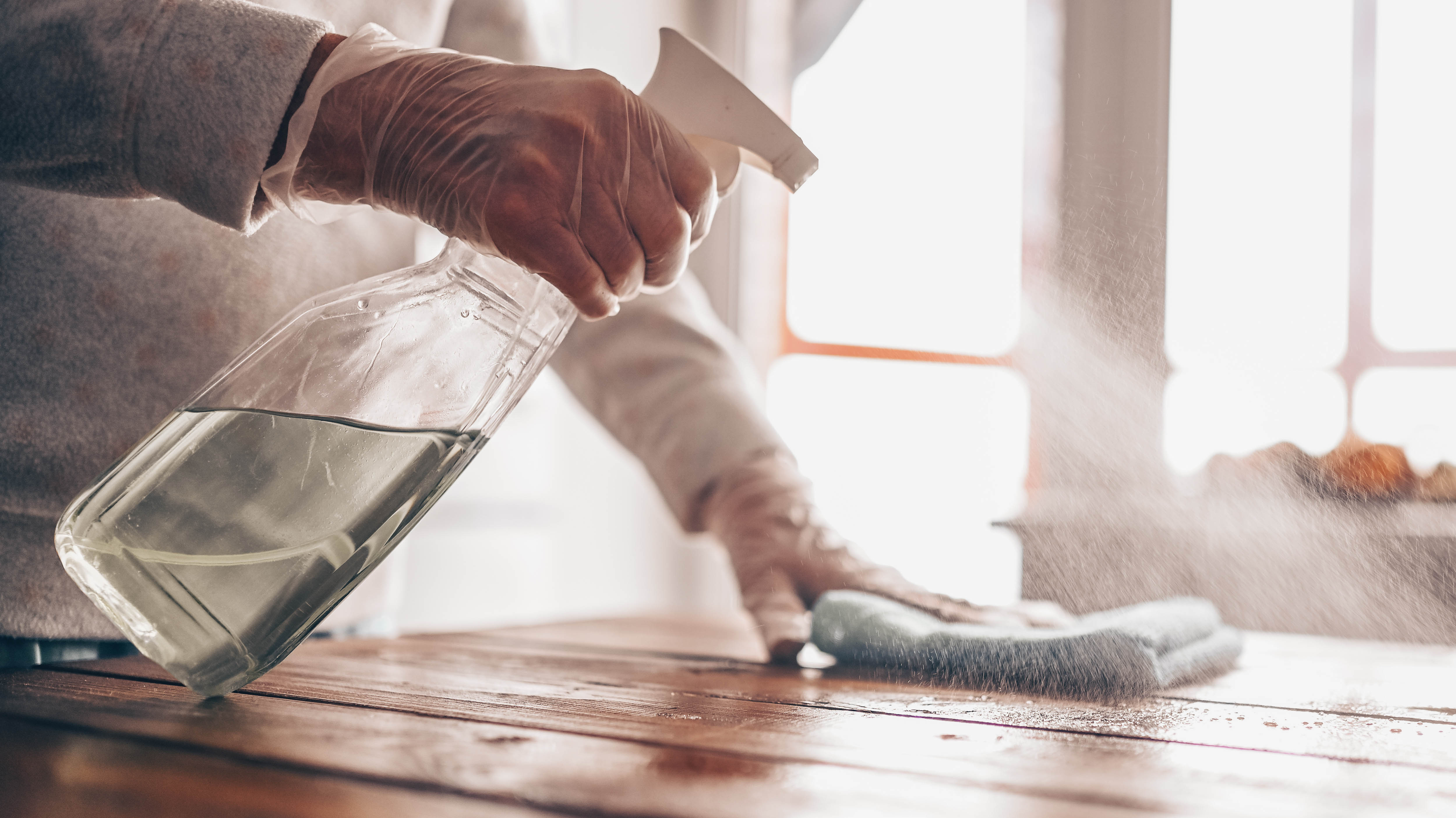 A wooden table being cleaned