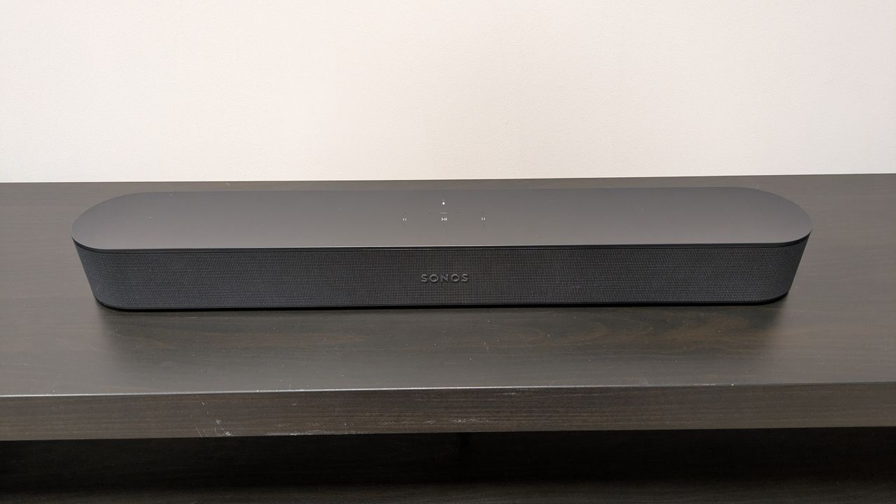 Sonos Beam on dark wood stand