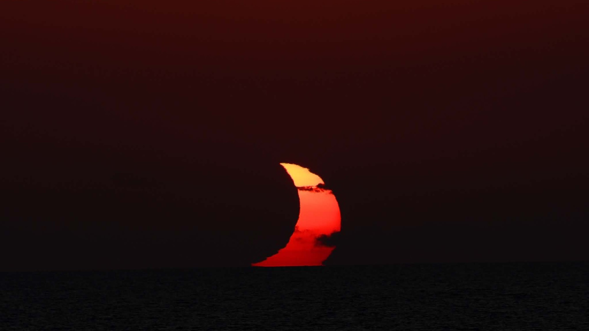A weather satellite 22,000 miles above Earth saved my 2026 total solar eclipse cruise on the Mediterranean Sea 6 MyCelestialApp people sit on the deck of a ship wearing paper sunglasses, looking skyward