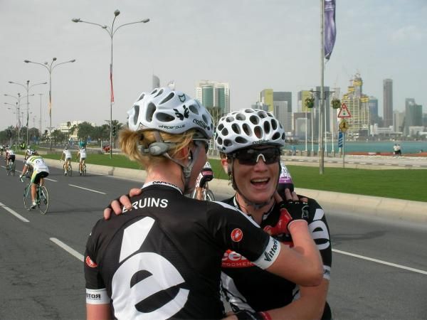Kirsten Wild celebrates with her teammate Regina Bruins.