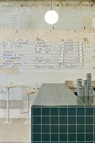 An image of the restaurant counter with the menu on tha wall