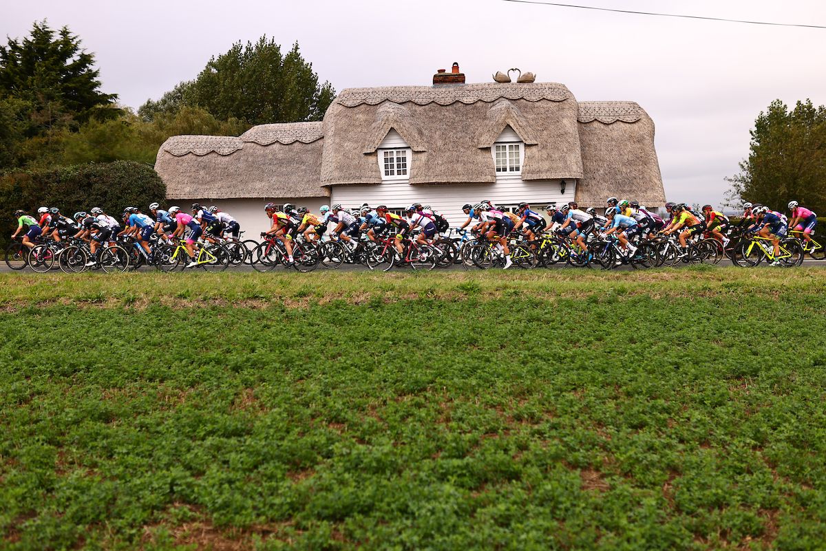 Picture by Alex Whitehead/SWpix.com - 07/10/2021 - Cycling - AJ Bell Women's Tour of Britain - Stage Four: Shoeburyness to Clacton-on-Sea, England - The peloton passing in front of a thatched cottage