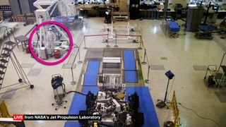 JPL technicians perform final checkout of NASA Mars 2020 rover. Note the on-the-floor onlooker wearing sunglasses.