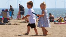 Children walking on a beach