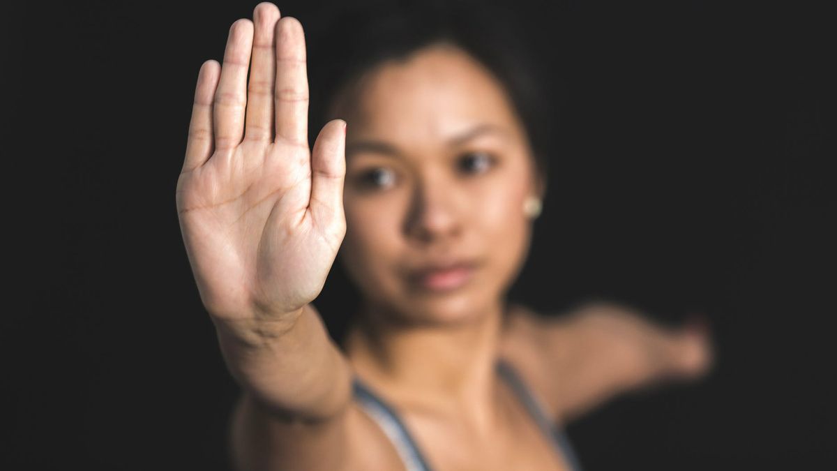 Woman making &#039;halt&#039; sign