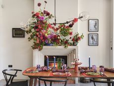 fireplace and dining table set up for a colorful christmas