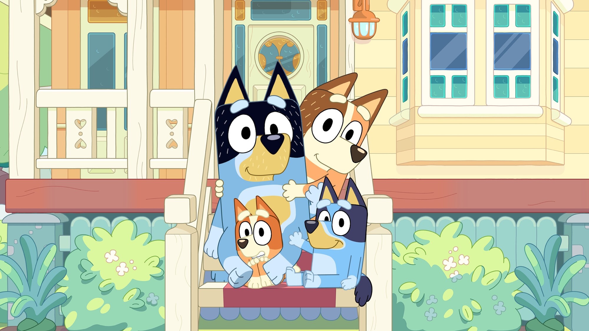 The Bluey family standing in front of their home