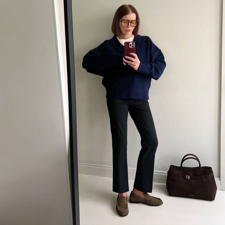 Belle wears a spring outfit with taupe loafers.