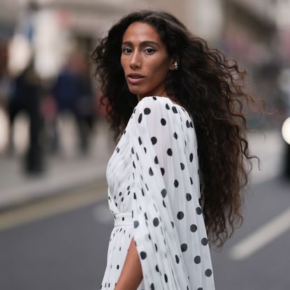  Ciinderella Balthazar with floating layers, wearing a polka dot dress