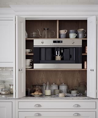Grey kitchen cabinet with wooden shelving and coffee machine