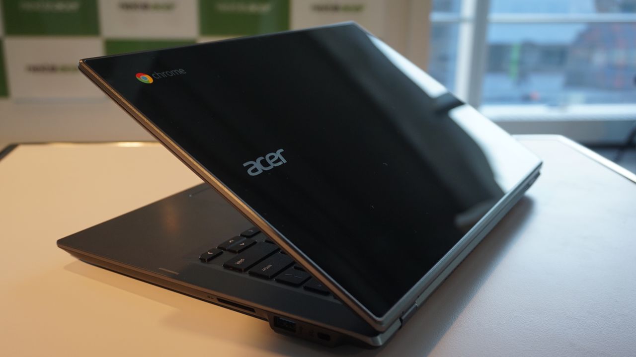 The Acer Chromebook 14 for Work from the rear with the lid half-closed