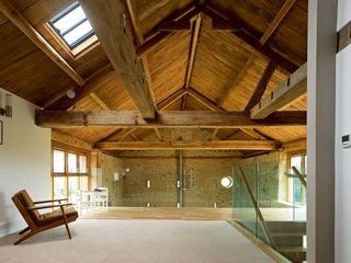 Interior of barn conversion with repaired roof and mezzanine area