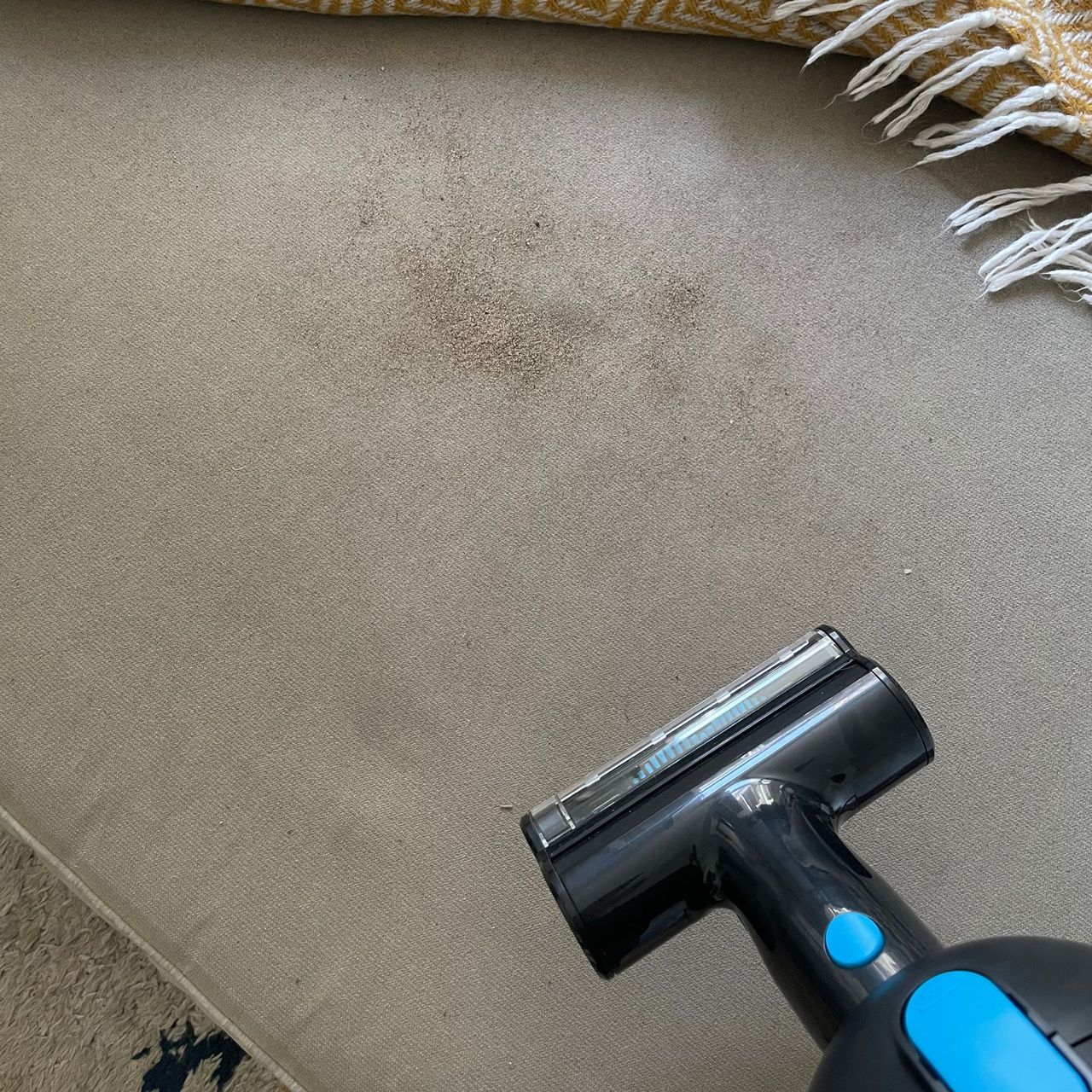 Using mini power brush on beige footstool