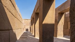 An ancient Egyptian temple against a blue sky