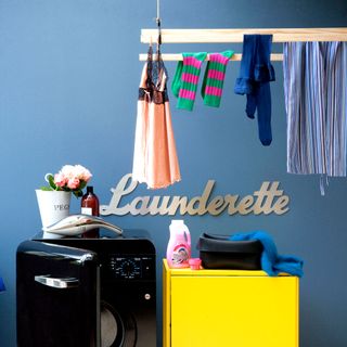 laundry room with launderette sign