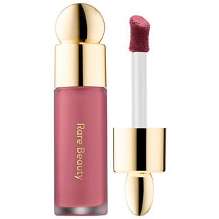 A liquid pink blush with a gold lid 