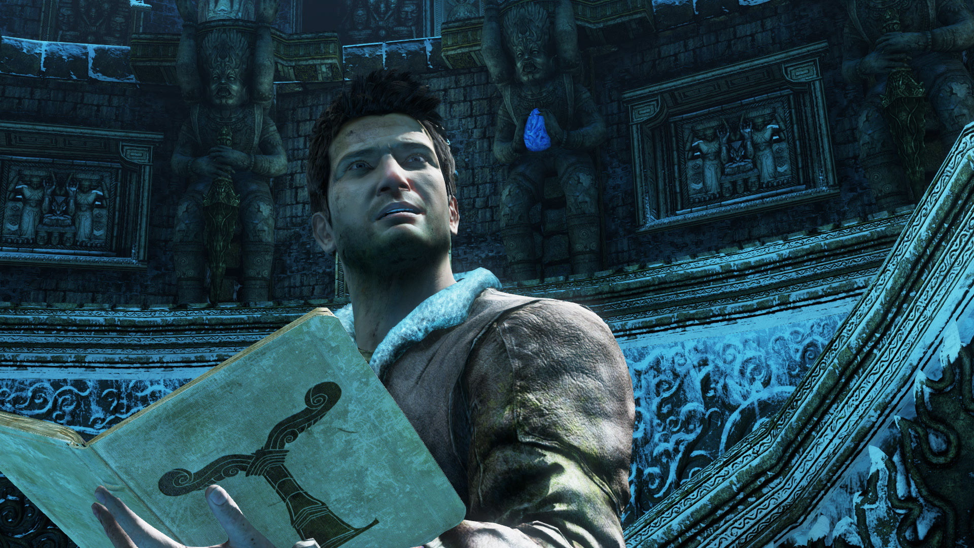 Nathan drake looking at an ancient text in Uncharted 2