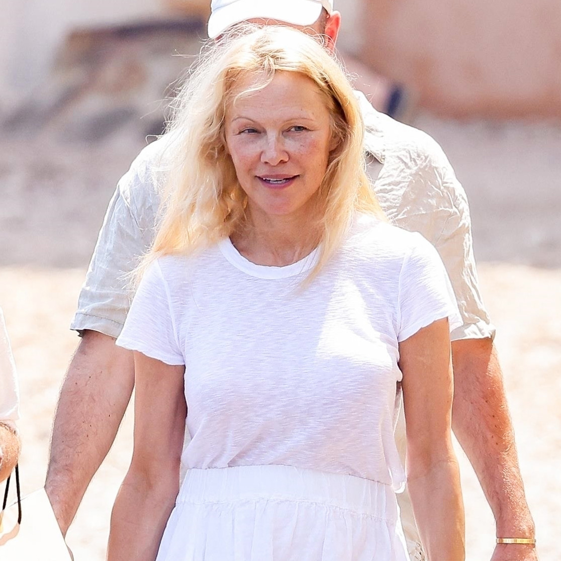 Pamela Anderson Just Wore Summer 2024's #1 Skirt Trend With Trainers in France