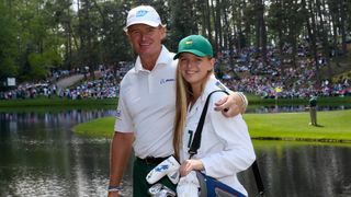 Ernie Els and daughter Samantha pose for a photo at the 2014 Masters Par 3 Contest