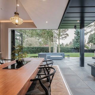 bifold corner doors leading to modern slate patio