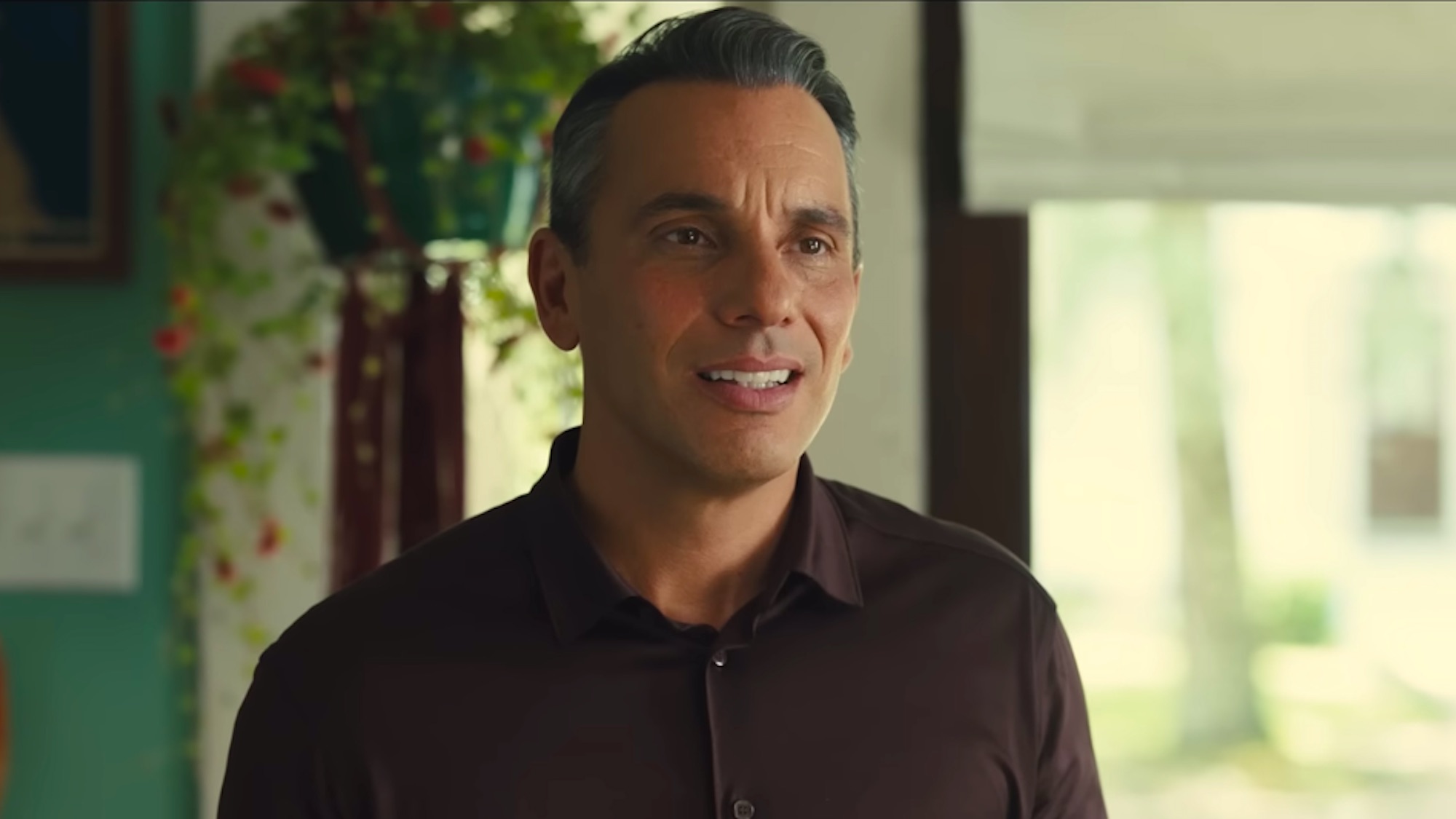 Sebastian Maniscalco in a brown polo in About My Father movie.