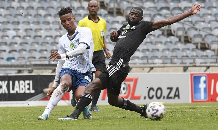 Brian Hlongwa of Uthongathi challenge ged by Deon Hotto of Orlando Pirates 