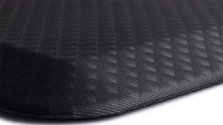 A black, ridged, anti-fatigue mat.