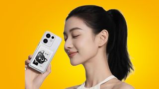 The Honor Life S3 being held in the hand on a yellow background