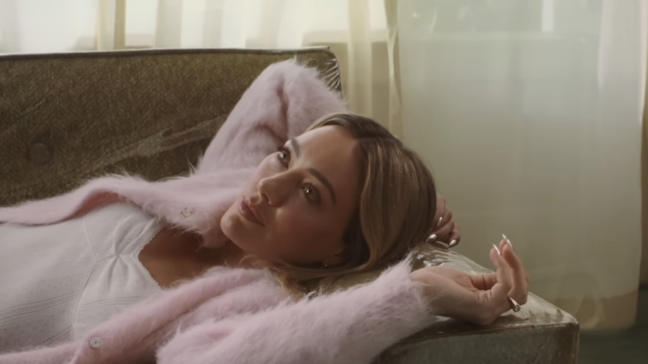 Hilary Duff in a pink sweater for the Weather For Tennis video