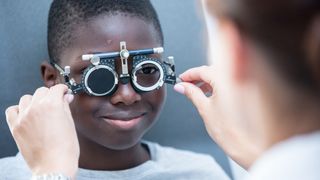 A young child has their eyes tested during a routine eye exam