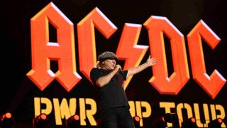 AC/DC’s Brian Johnson performing onstage at the Veltsin Arena in Gelsnekirchen, Germany