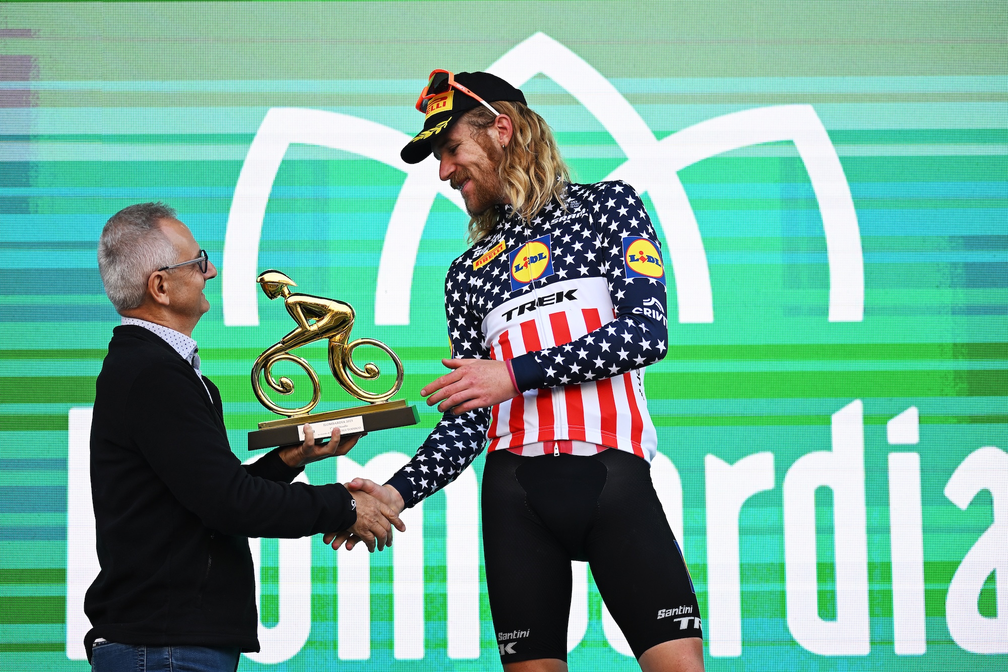 USA's Quinn Simmons of Lidl - Trek celebrates at podium as most combative rider prize winner during 2025 Il Lombardia