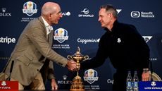 Jim Furyk and Luke Donald shake hands at a Ryder Cup press conference