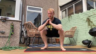Author performing an unweighted squat wearing Hytro shorts